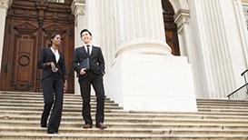 man and woman on courthouse steps